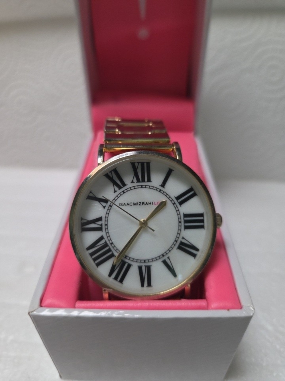 Isaac Mizrahi Gold Tone Watch with White Dial and Black Roman Numerals